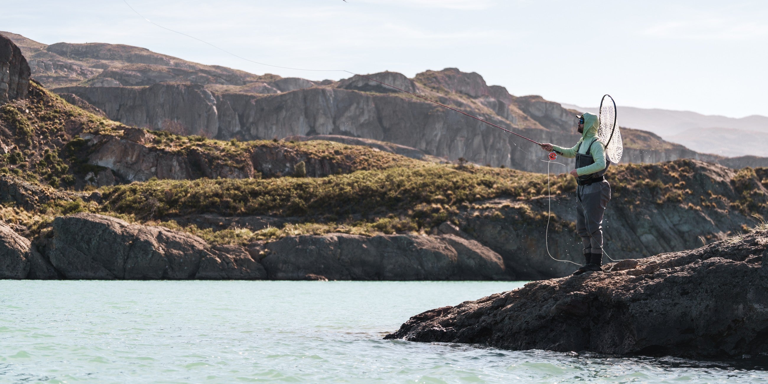 Man standing on a rock fishing