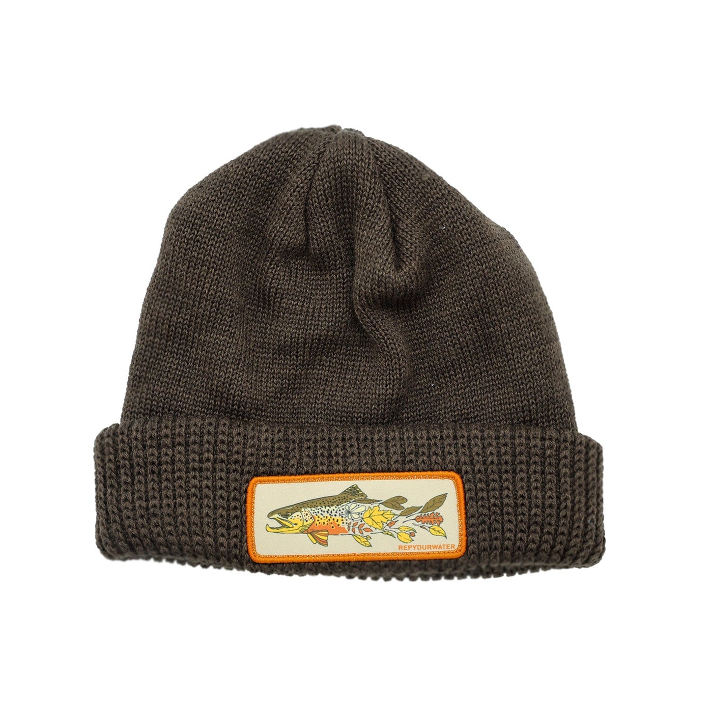 Brown knit hat with patch fall brown trout transitioning into autumn leaves
