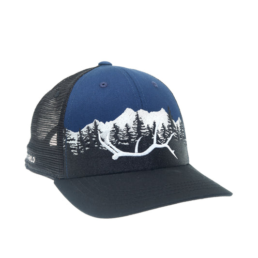 A hat with black mesh and a black brim has a white embroidered elk antler in front of pine trees and a mountain with blue fabric in the background