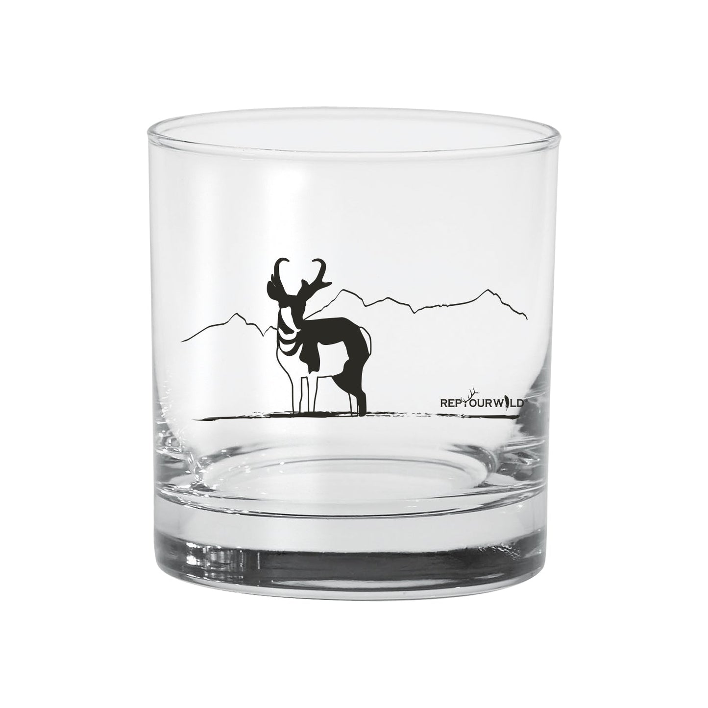 a clear glass with an antelope on the side in black ink
