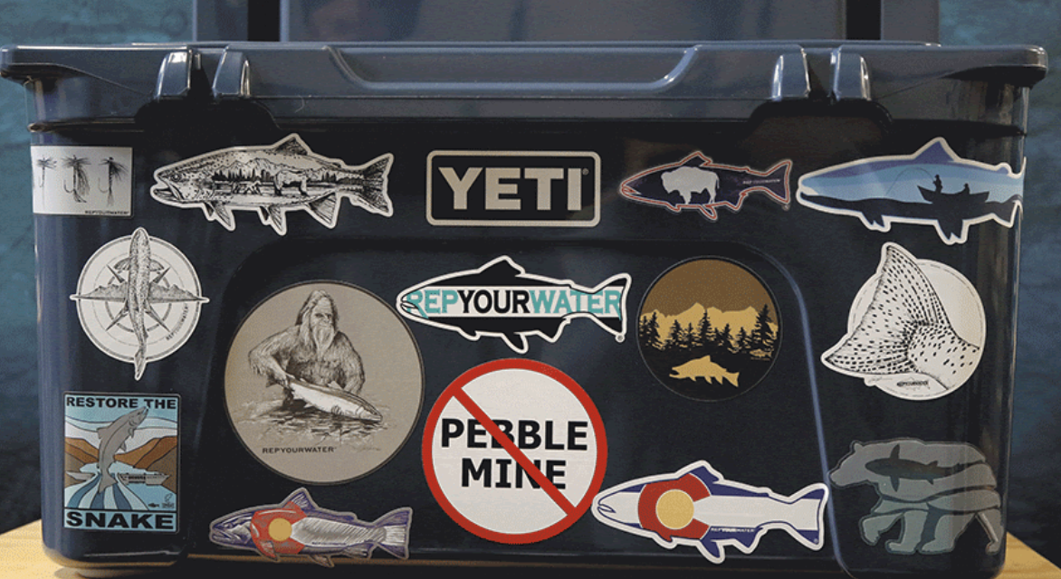 cooler with multiple stickers affixed