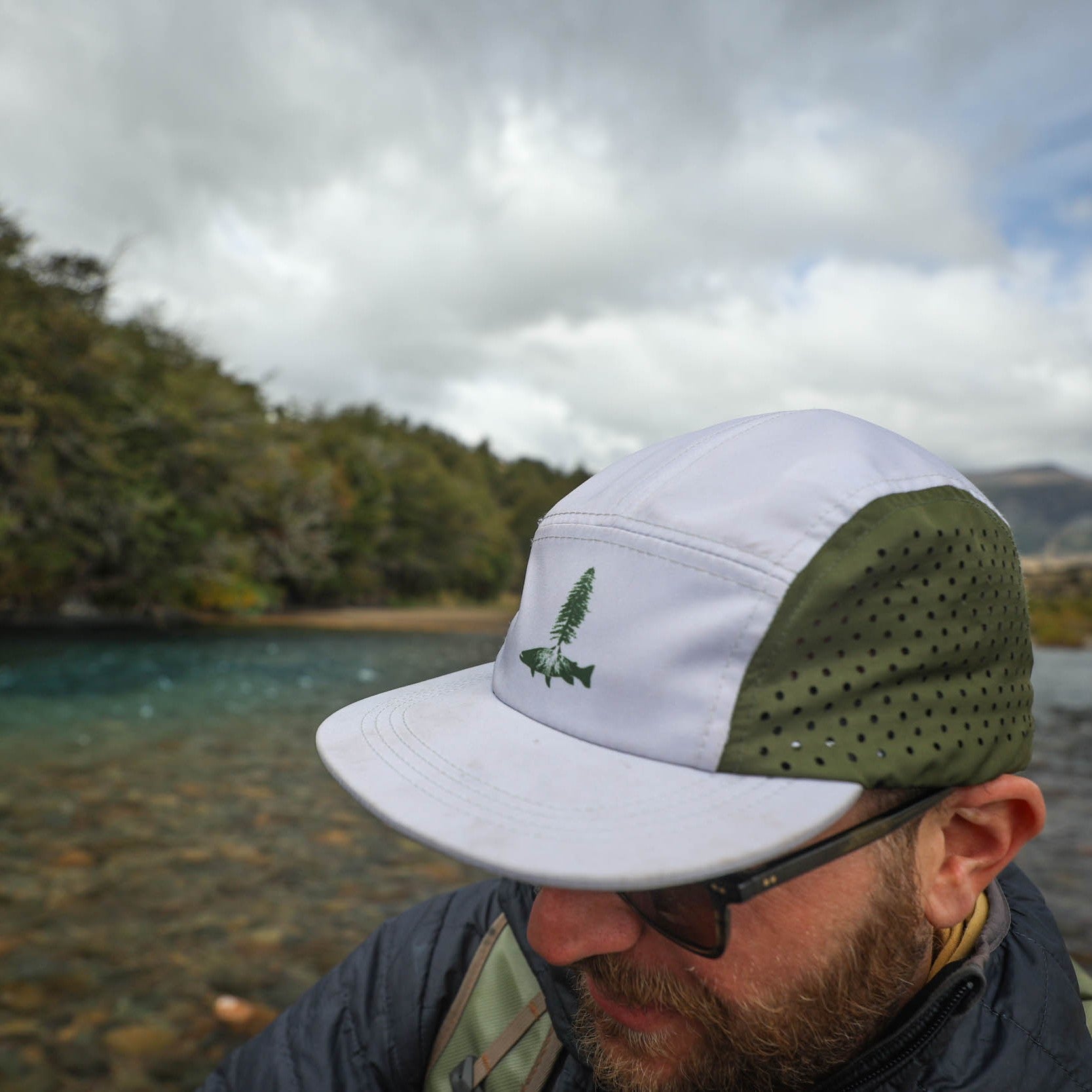 Man wearing fly fishing roots camp hat by repyourwater spring 2025 collection
