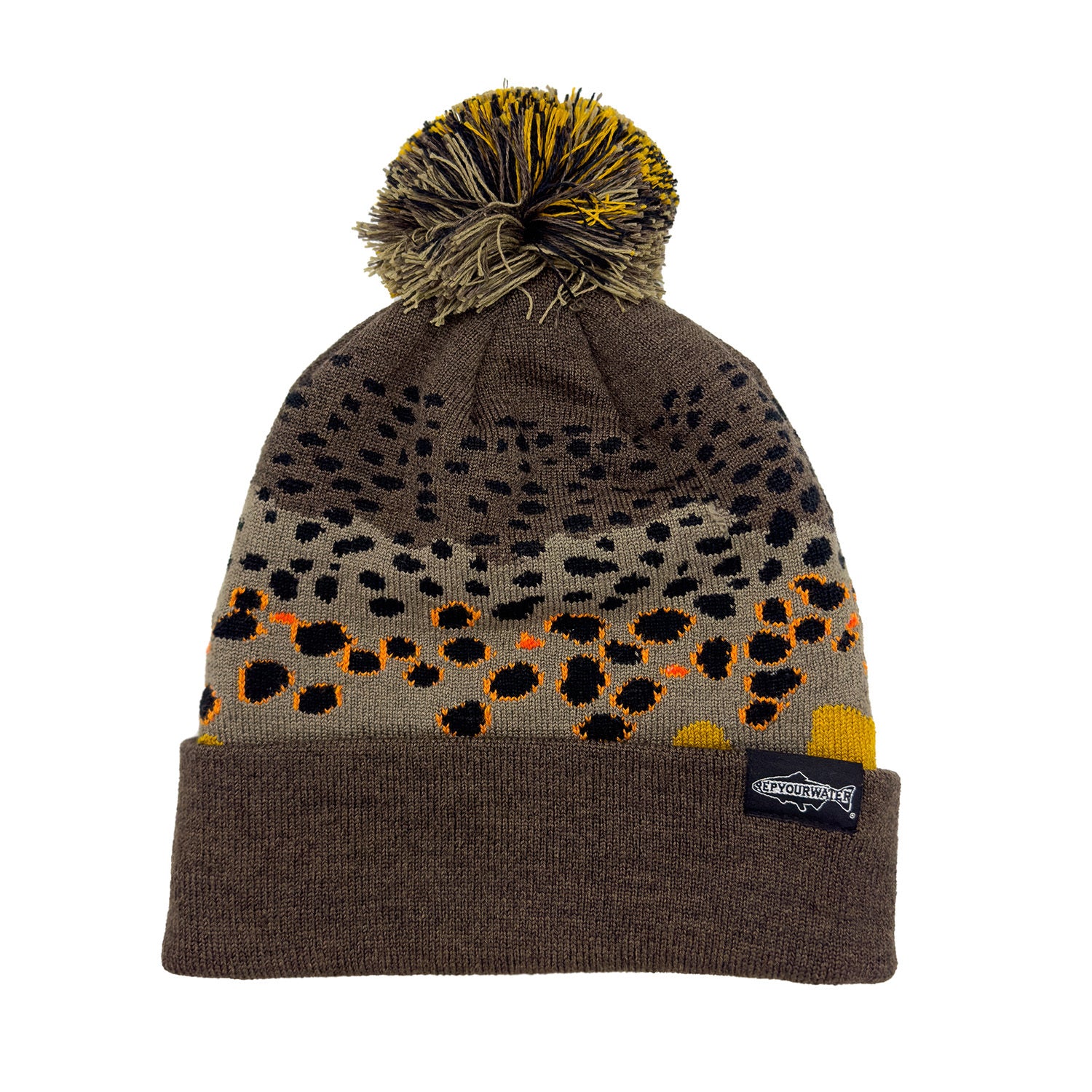 A knit hat with a camouflage pattern resembling brown trout skin, featuring a yellow pom-pom on top.