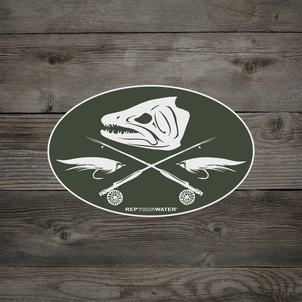 Oval RepYourWater sticker with a fish skull above crossed fly rods and flies on a wood background.
