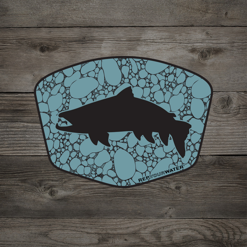 RepYourWater sticker with a fish silhouette over a light blue pebble pattern on a wood background.