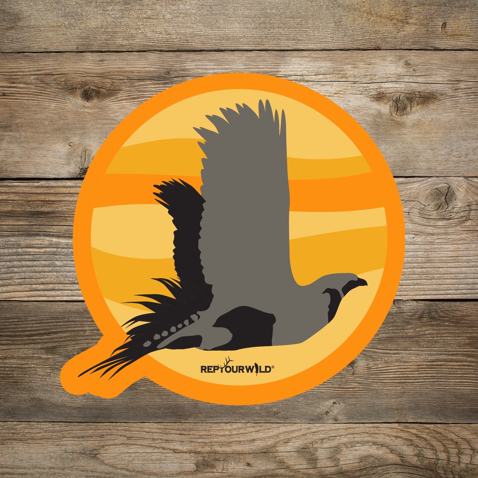 Round sticker shades of orange background with flying sage grouse