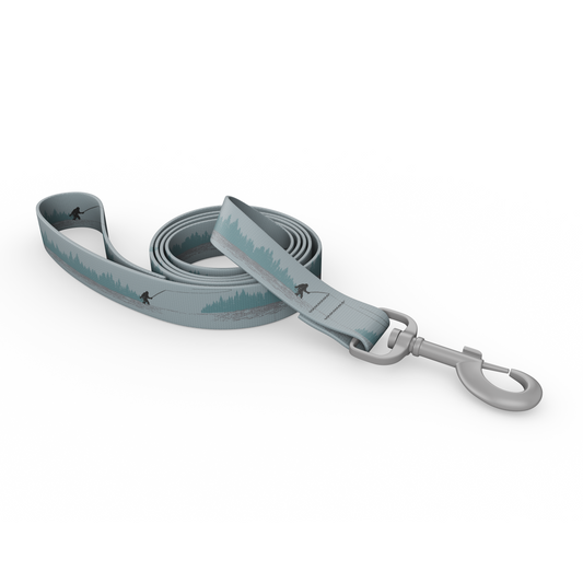 Dog leash in shades of blue and gray with a silhouette of sasquatch casting and foliage