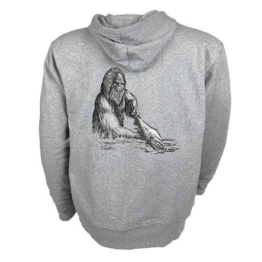 A grey hoody with artwork showing sasquatch holding a fish on the backl