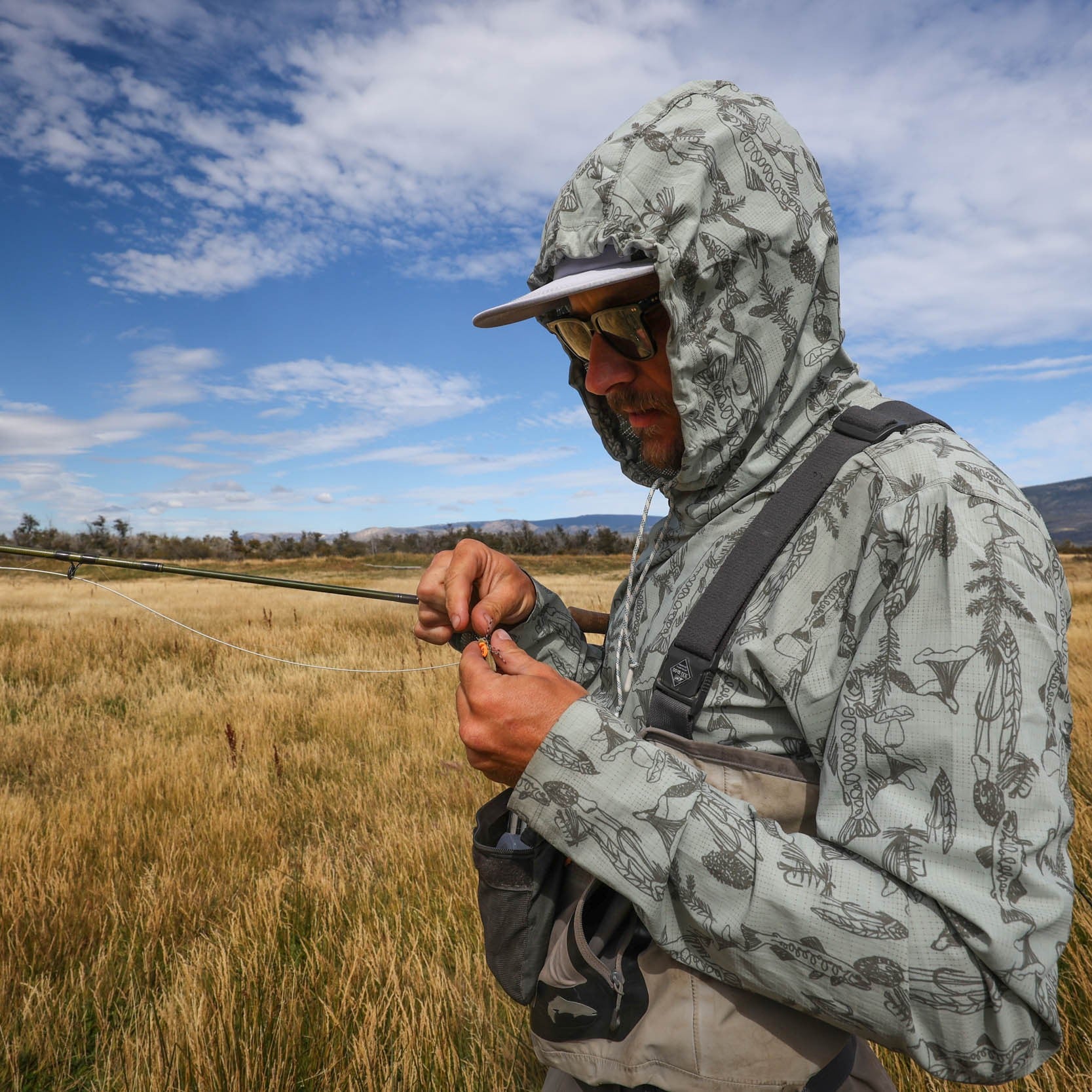 man with hood on of the spring forest flolite sun hoody by rep your water