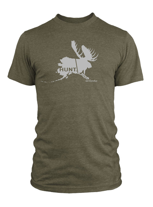 a green short sleeved tee shirt with a print in light gray of the state of alaska on one side and the head of a moose on the other side the word HUNT shows within the state of alaska 