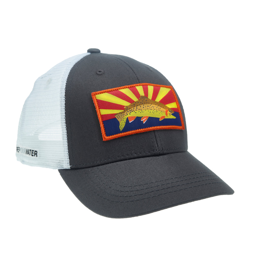 A hat with white mesh in back and gray fabric in front with a rectangular patch showing an apache trout with a stylized sunset behind it