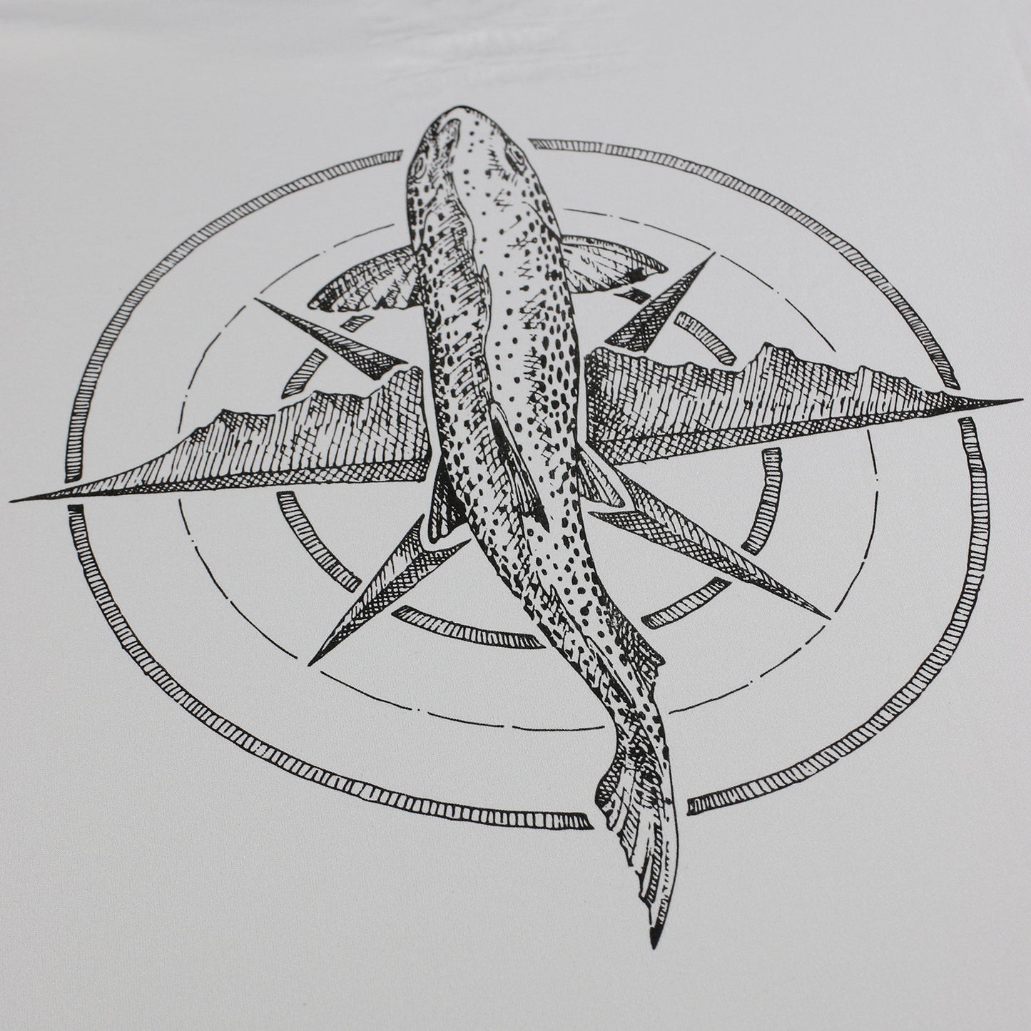 A detail photo of the trout compass themed design.