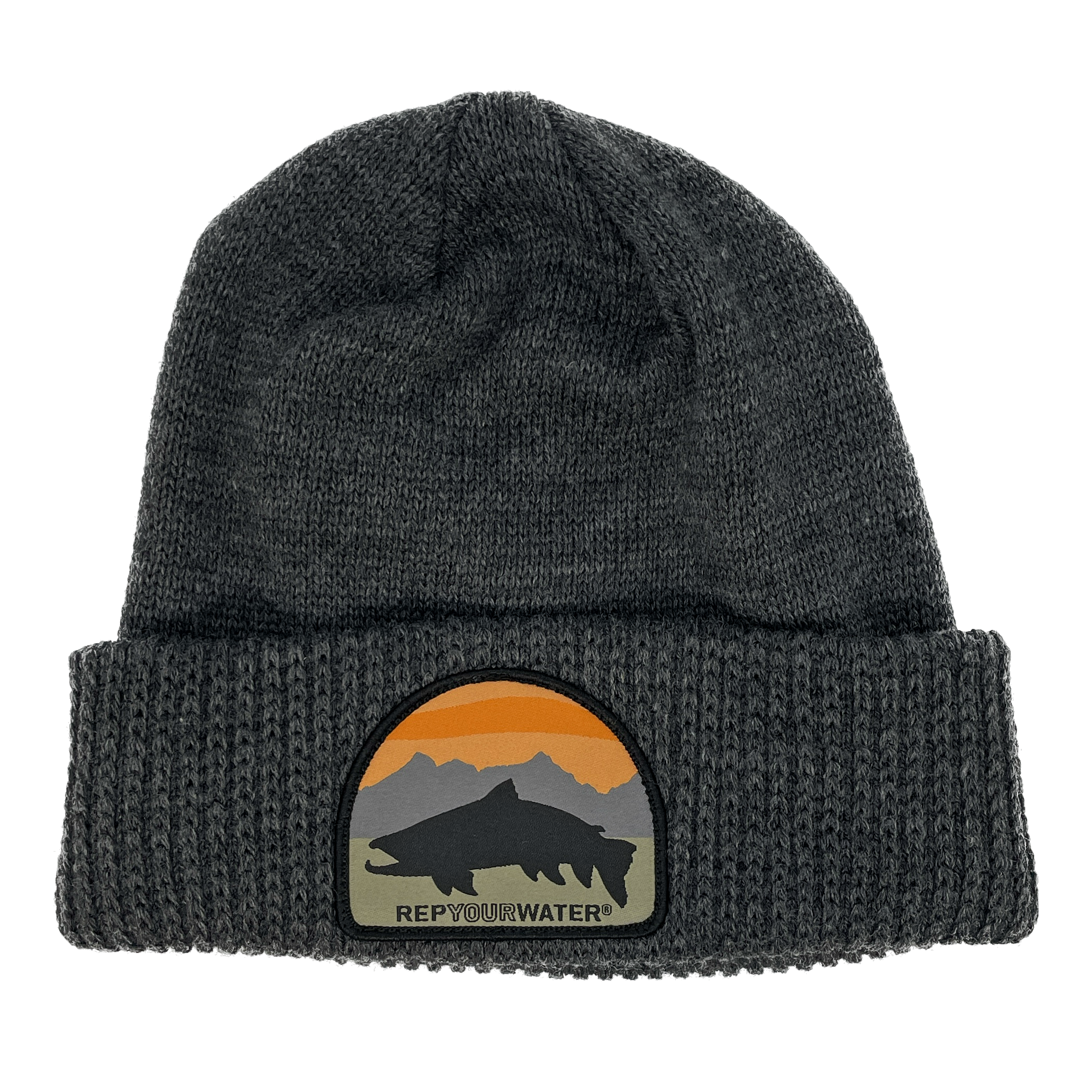 A gray winter hat with a cuff and a patch on the cuff with a mountain range background with a black trout silhouette