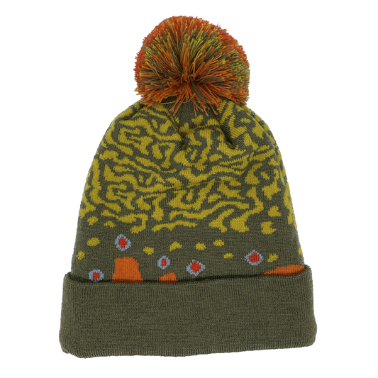 A winter hat imitating brook trout skin with a red and green poof on top and a green cuff 