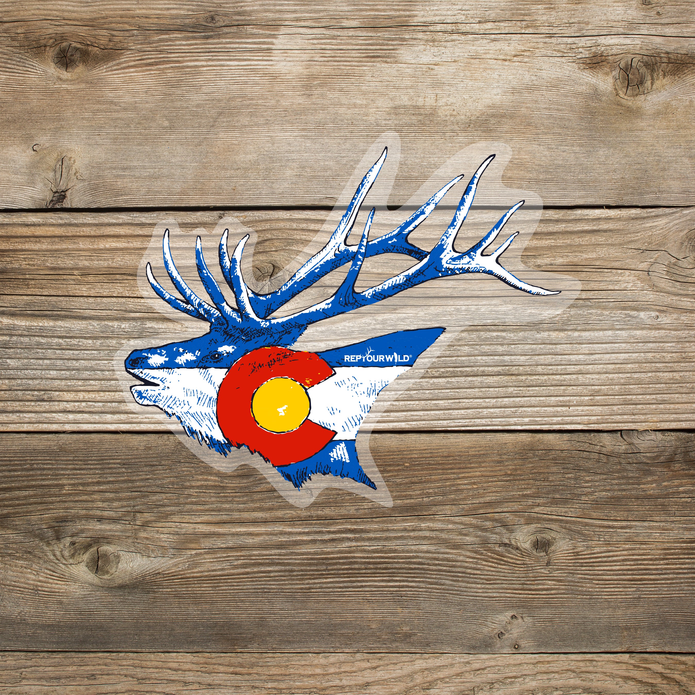 Stylized blue elk head with antlers incorporating the Colorado flag design, shown as a sticker on a wooden background.