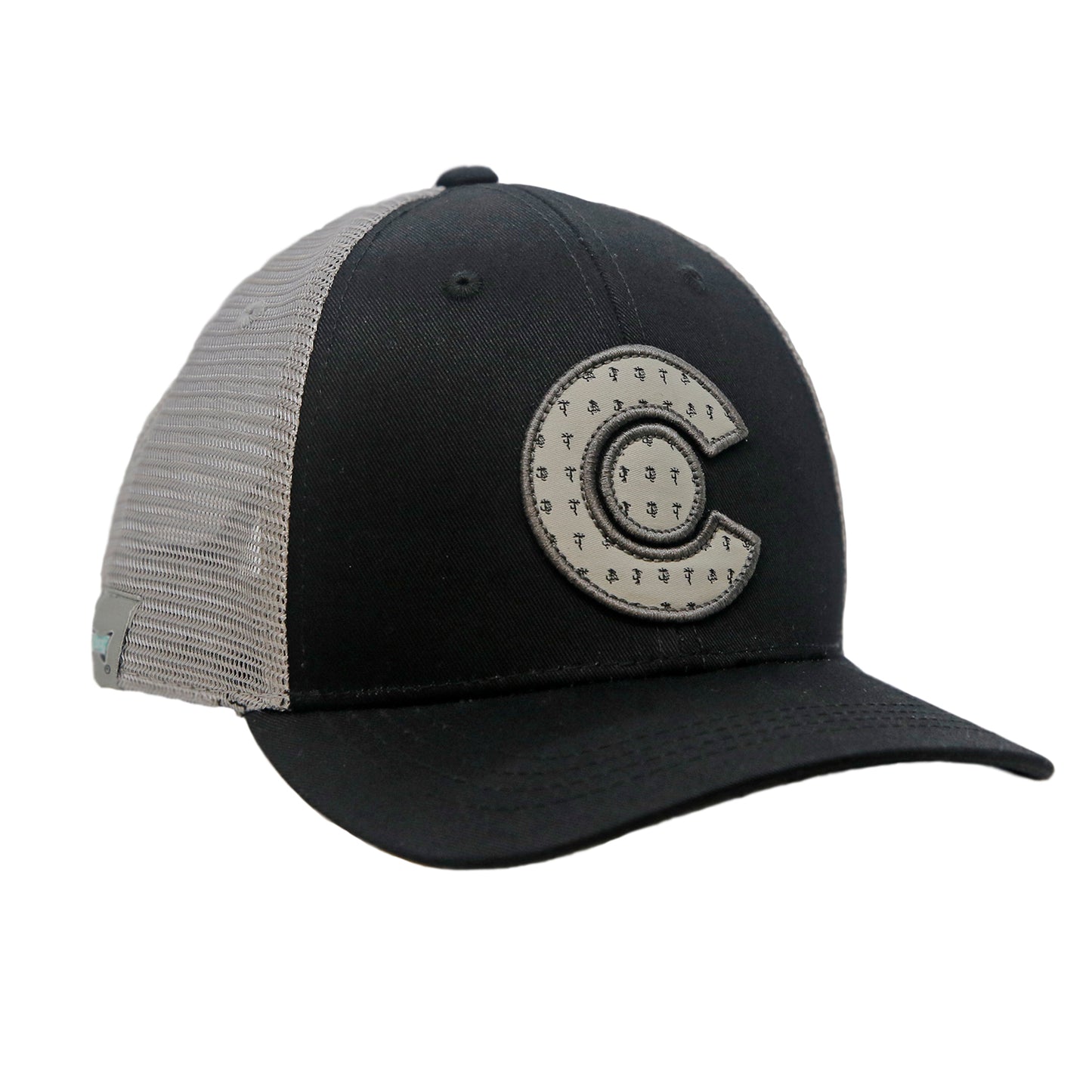 A hat with gray mesh and black front fabric has a patch in the shape of the letter C with a circle in the middle.  Both parts of the patch have a print of dry flies repeated throughoutule