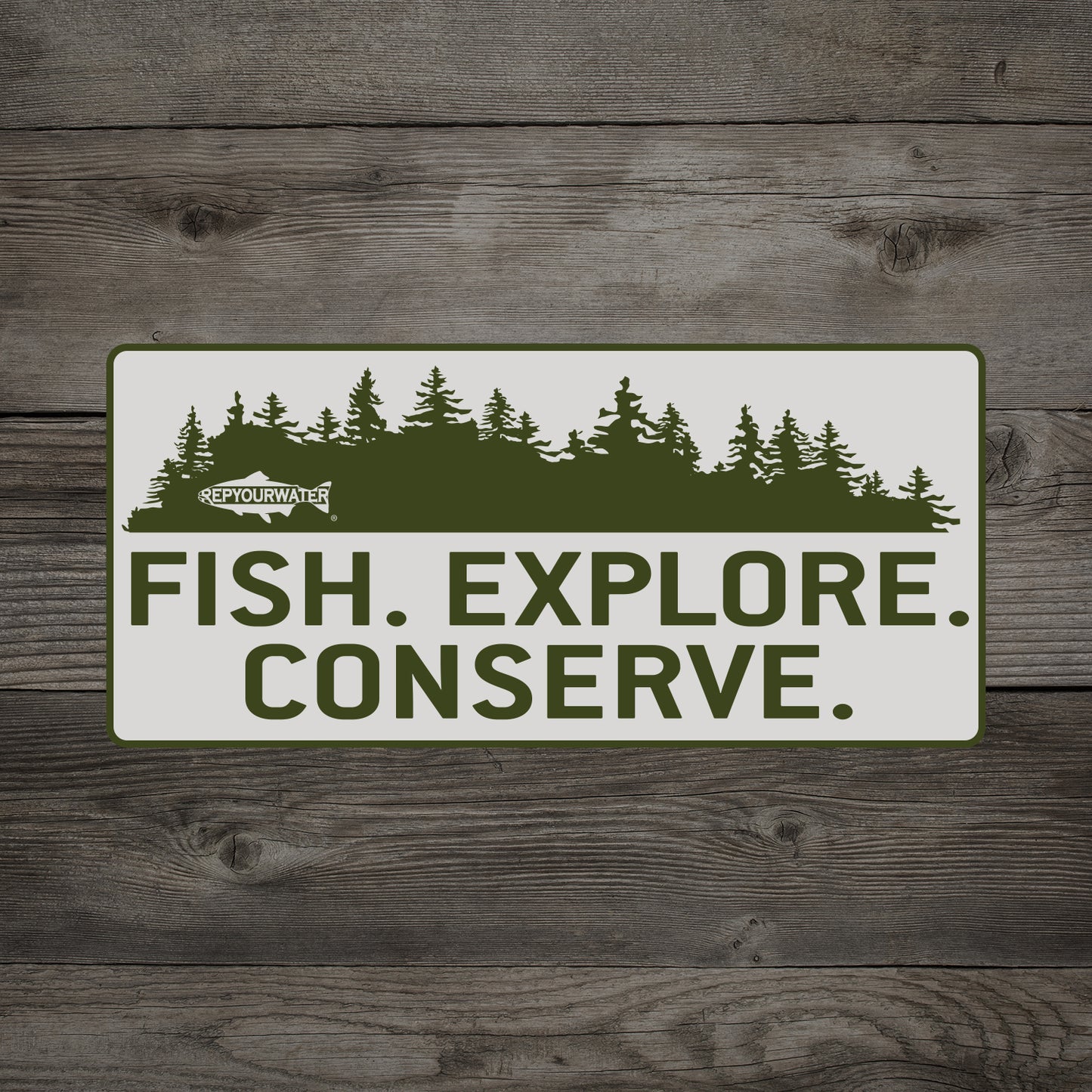 A wooden background has a mockup of a sticker on it which has pine trees above the words fish explore conserve. In the pine trees is a logo that reads repyourwater inside a trout silhouette
