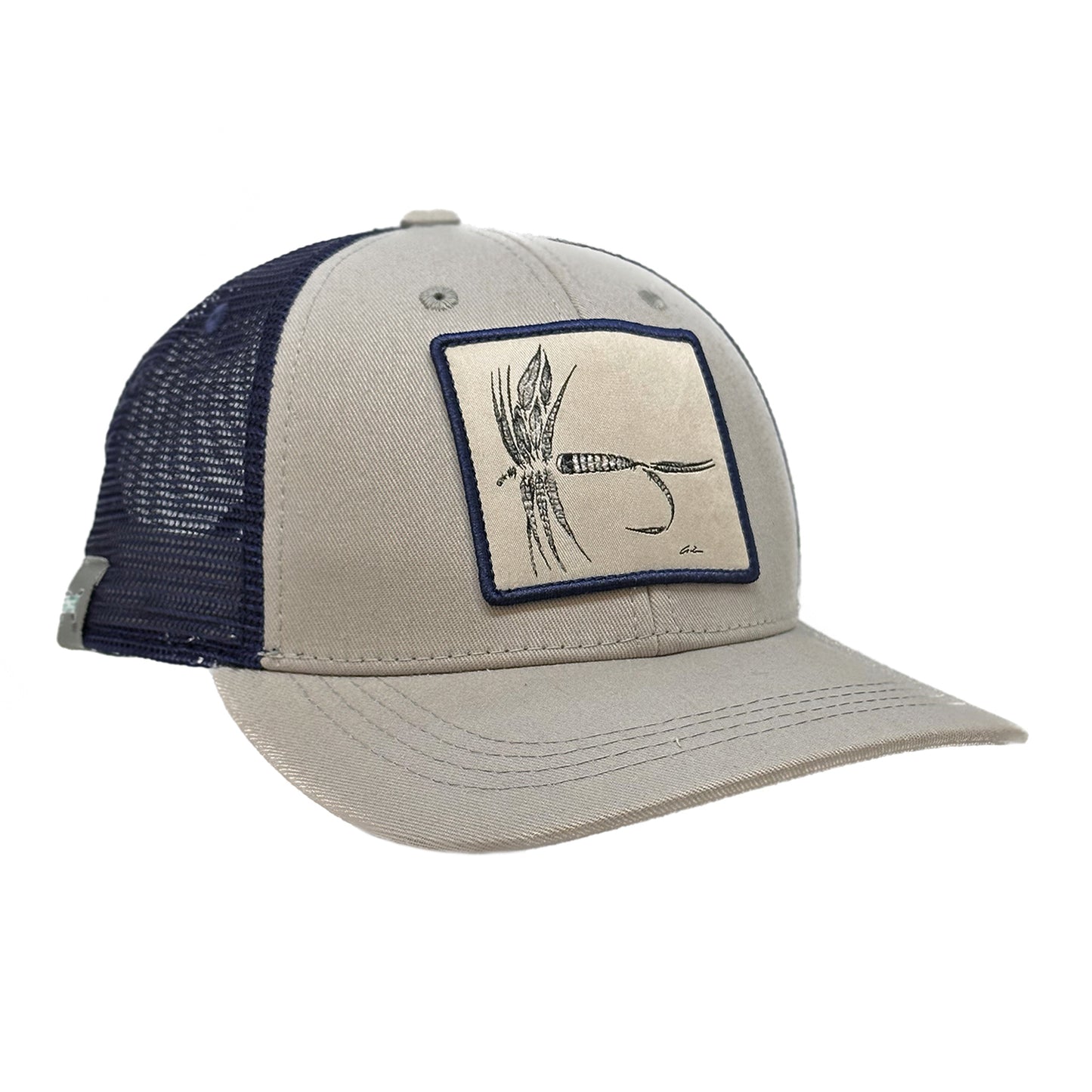 A light gray hat with navy mesh back with a patch of a dry fly made up of feathers