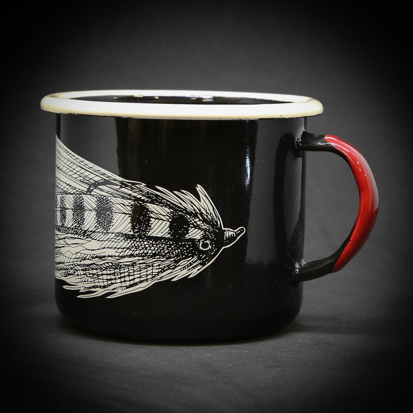 A black mug showing the front half of a streamer