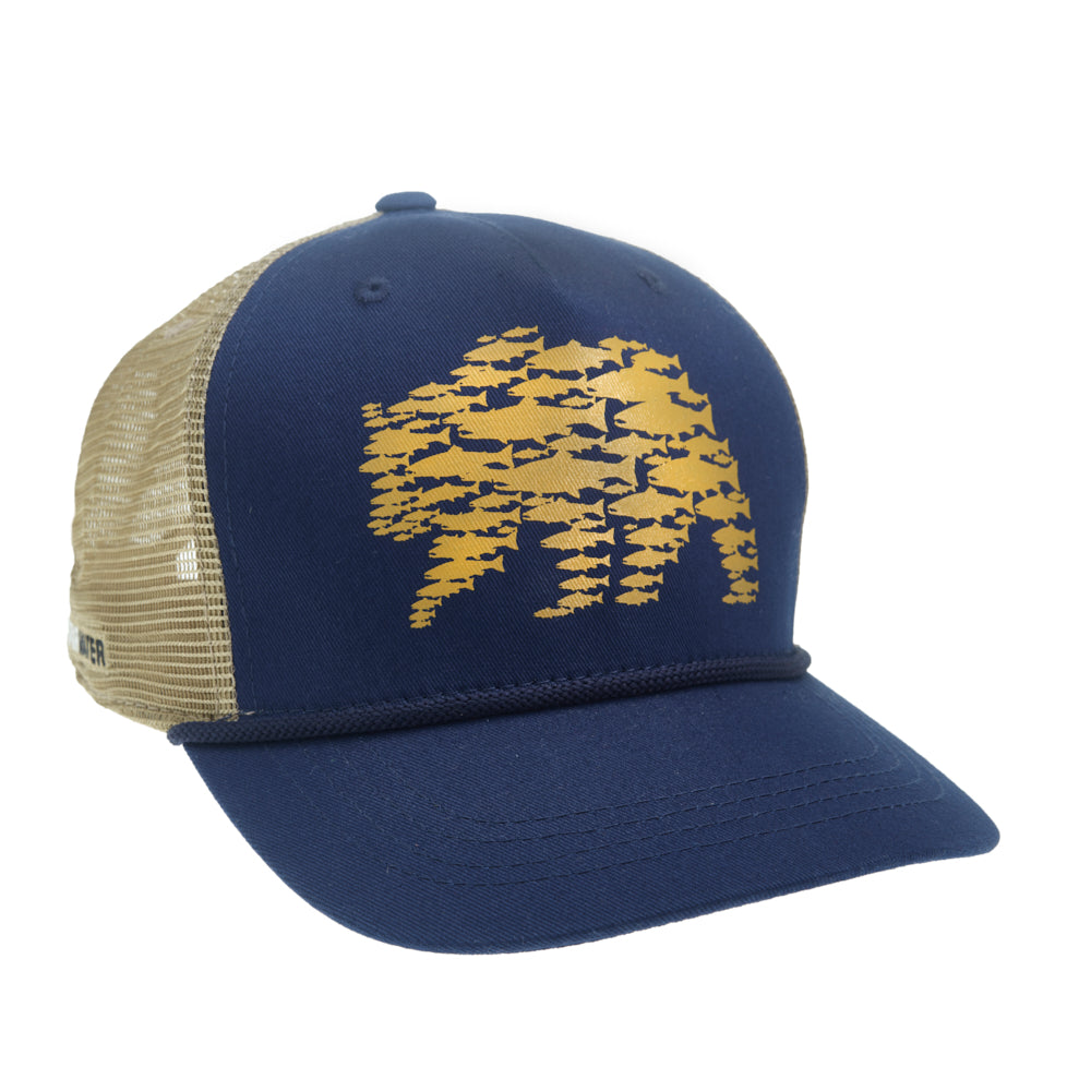 A hat with tan mesh in back and blue fabric in front has a grizzly bear made out of trout on the front with a rope above the bill