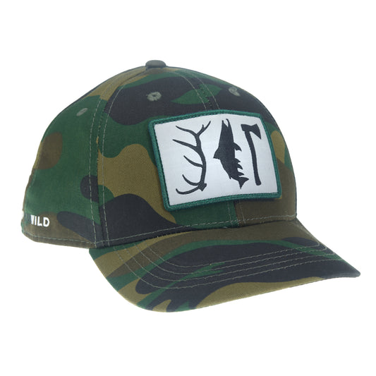 A camouflaged pattern full fabric hat with a rectangular patch on the front featuring an elk antler, a trout and a hatchet.