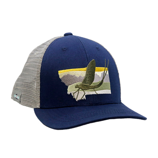 A hat with light gray mesh in the back, navy cloth in the front and an embroidered design on the front that features the state shape of Montana with a mayfly inside of it.