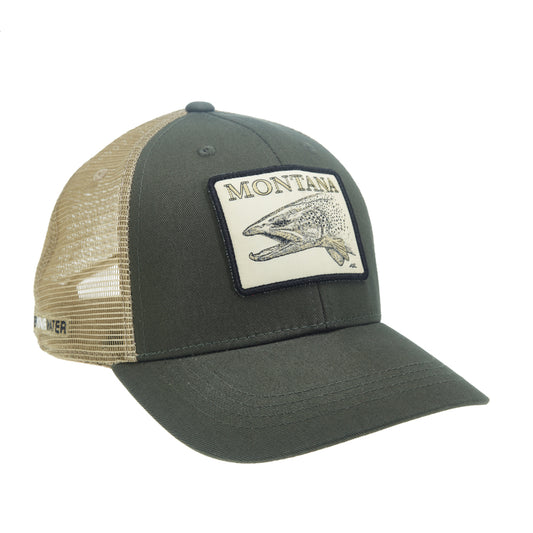 A hat with tan mesh in the back and green fabric in the front. It has a rectangular patch on the front that features a brown trout head and the word "MONTANA".