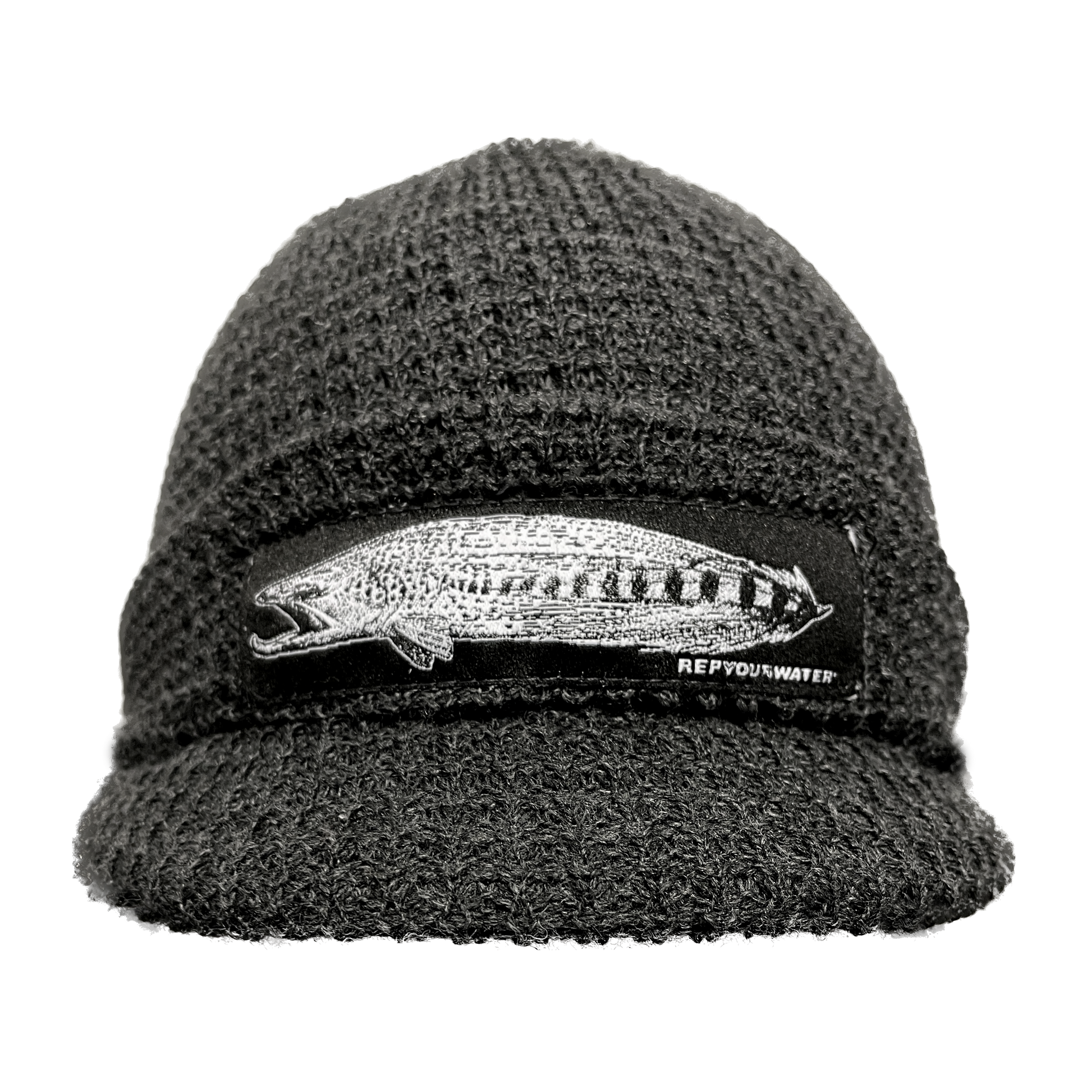 A dark gray winter hat with a cuff and a long rectangular patch on the cuff with a brown trout morphing into a streamer fly. Hat also has a small bill in the front of the same material