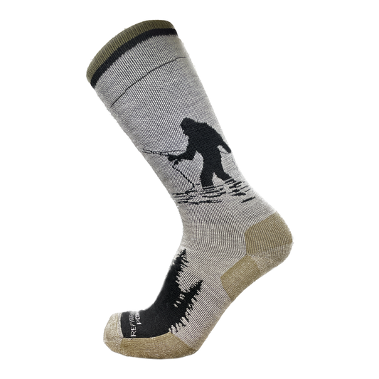 Gray socks with some light olive that show sasquatch fishing on the side. The socks have pine tree silhouette on the top of the foot and the words Rep your weater and pont 6 on the toes