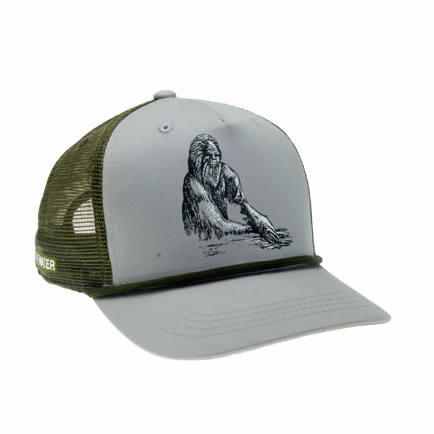 A hat with green mesh in back and gray fabric in front features a drawing of a sasquatch holding a trout in the water