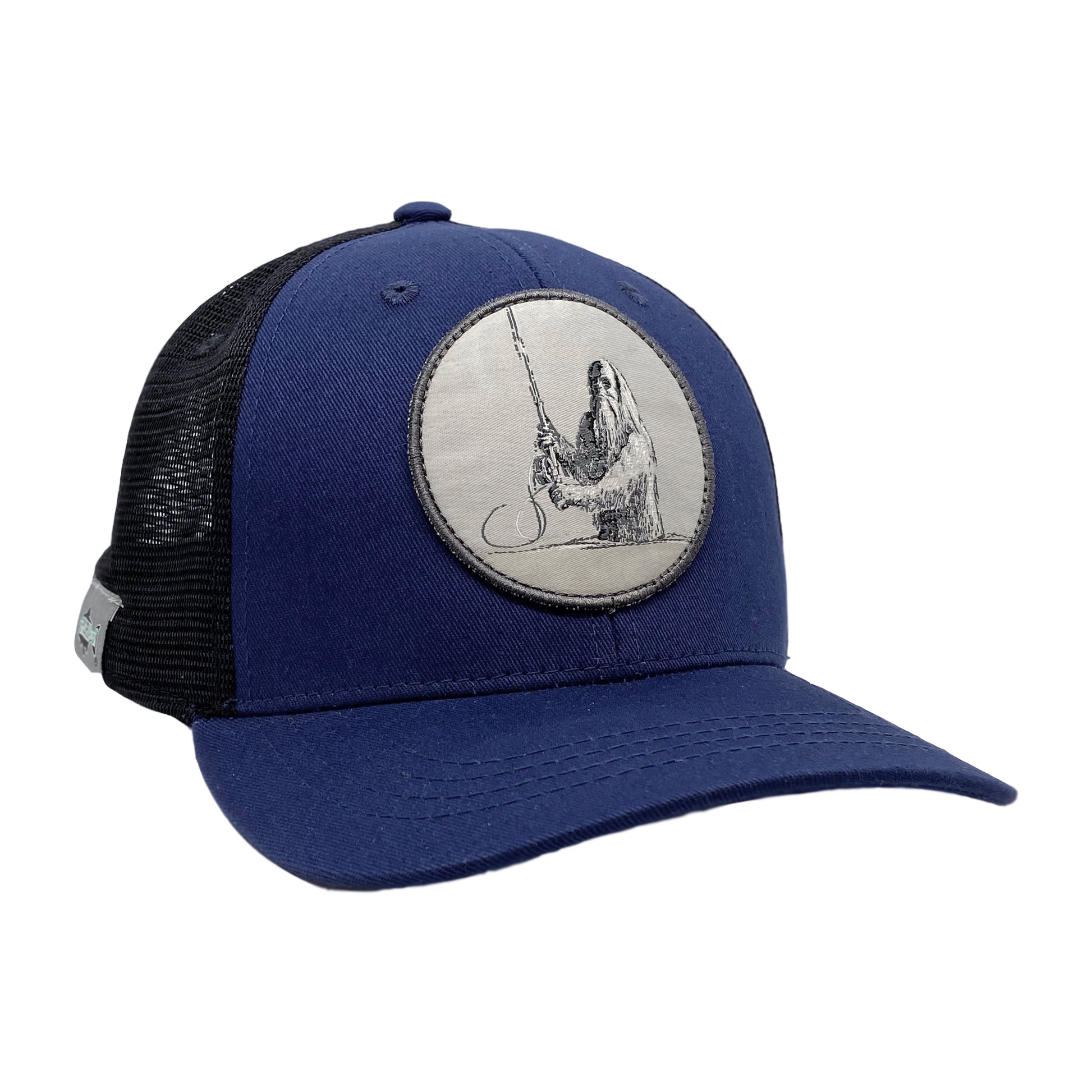 A hat with black mesh in back and blue fabric in front has a patch that features a sasquatch casting a spey rod