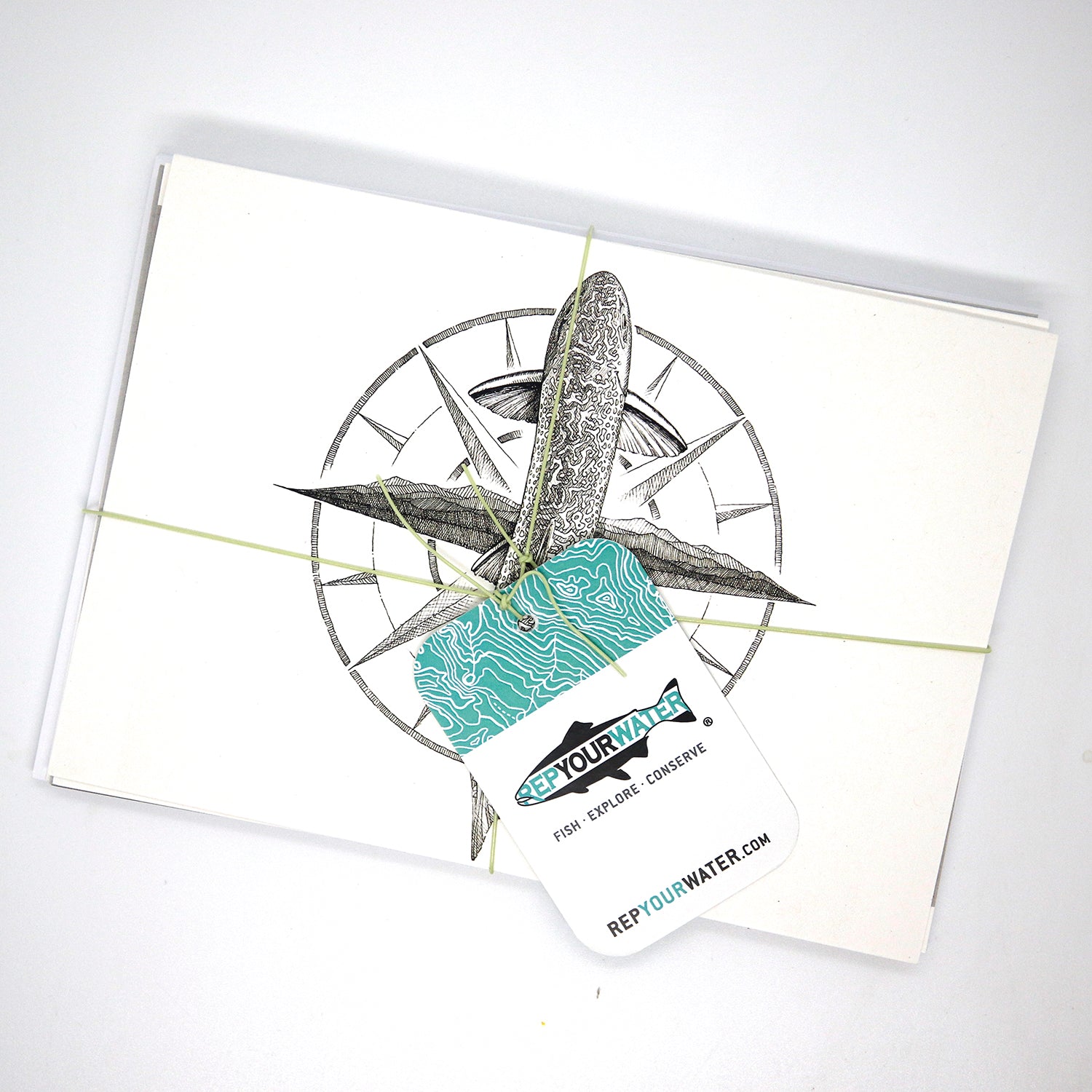 One stack of greeting cards with the same hangtag in the first image.  This only shows ta brook trout drawing with a compass