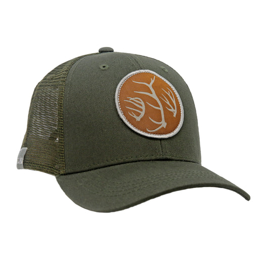 A hat has green mesh in back and green fabric in front has a circular patch with three antlers on it