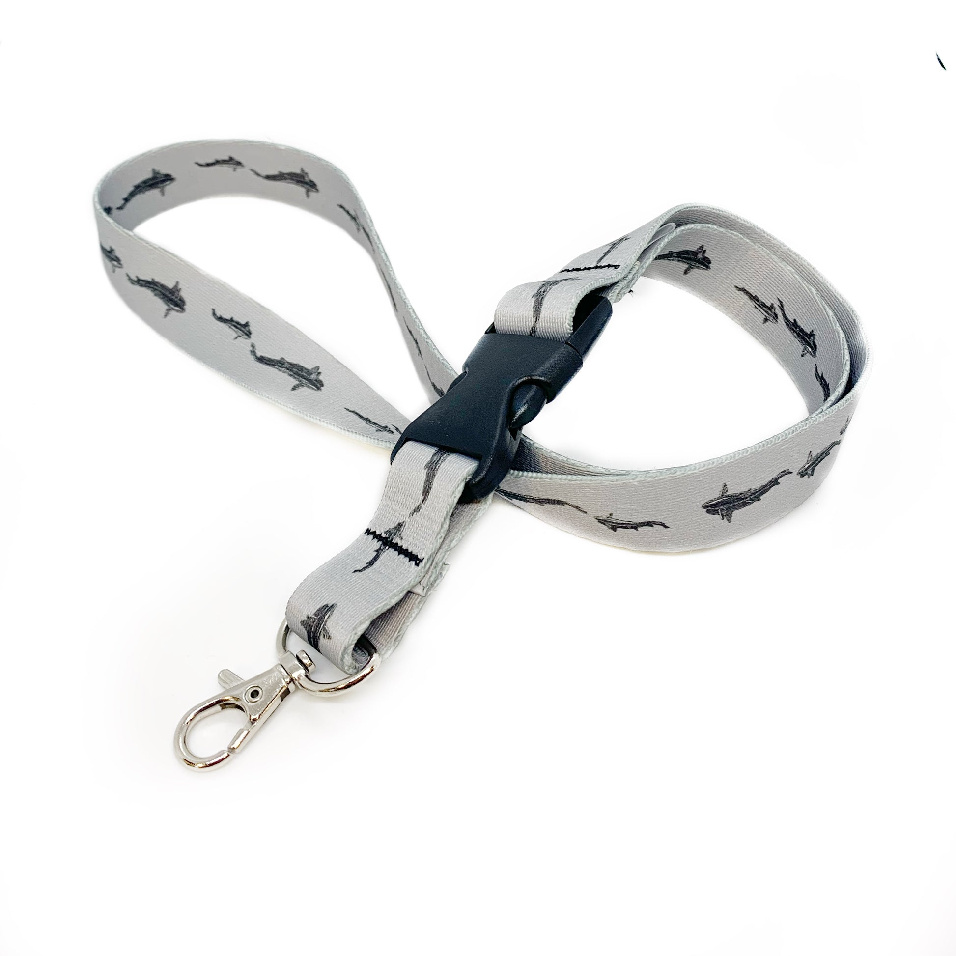 Gray nylon webbing neck lanyard with trout from above and with plastic buckle and metal clip