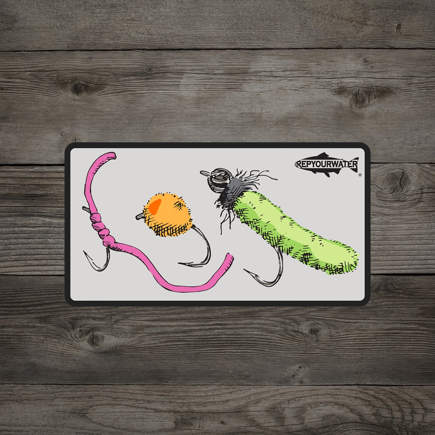 A wood background has a sticker on it featuring a worm fly egg fly and mop fly with a trout silhouette in the top right coner that reads rep your water