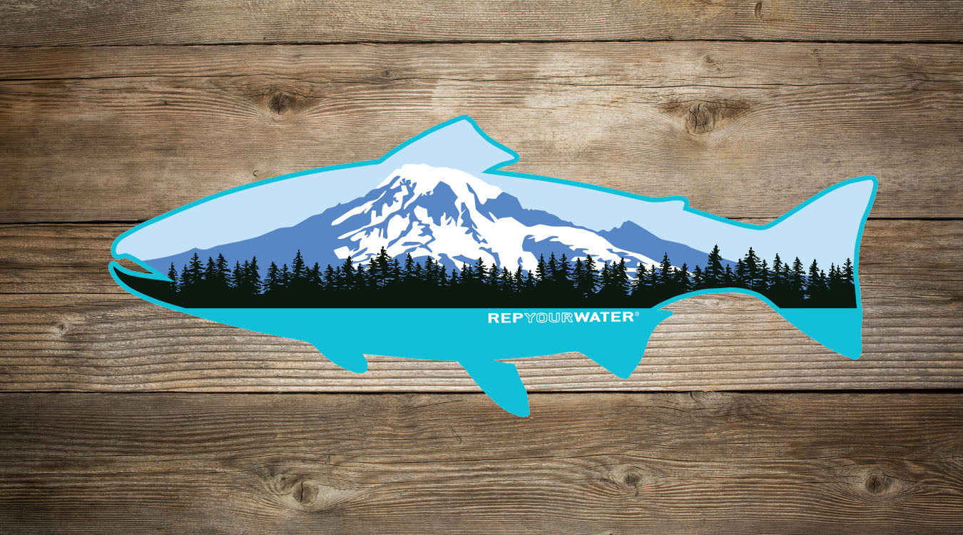A sticker on a wood background is in the design of a trout in front with a volcano inside of it and reads repyourwater