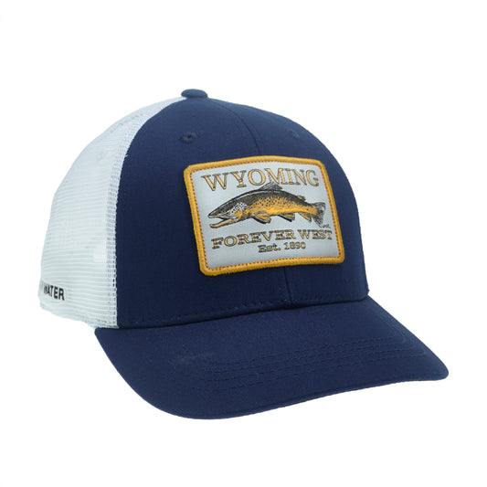 A hat with white mesh and blue fabric has a patch that reads wyoming forever west est 1890 with a brown trout